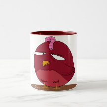 Pájaro rojo con el gusano taza de café