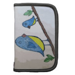 Pájaros azules en rama de árbol planificadores