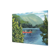 Pares Canoeing en un lago Lona Envuelta Para Galerías