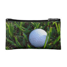 Pelota de golf y club de golf