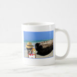 perro del boxeador en la taza de la playa