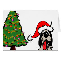 Perro tonto en el gorra de Santa Felicitación
