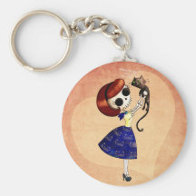 Pin del esqueleto encima del chica con su gato llaveros personalizados
