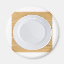 Placa y cubiertos en la tabla de madera iman