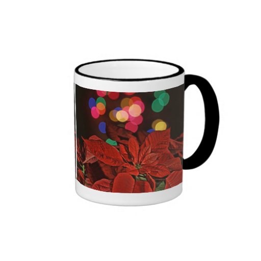 Pointsettia rojo y luces coloreadas brillantes taza de café