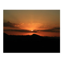 Puesta del sol del desierto postales
