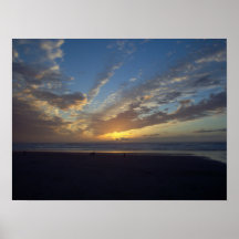 Puesta del sol en la playa de Nye Poster
