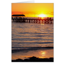 Puesta del sol en la playa y el embarcadero, Austr tarjetas