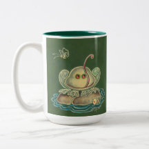 Rana divertida que pega la lengua hacia fuera a la tazas de café