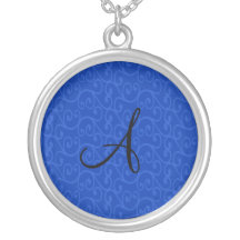 Remolinos del azul del monograma joyería