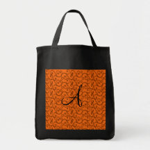 Remolinos del naranja del monograma bolsas
