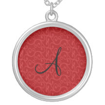 Remolinos del rojo del monograma joyerías