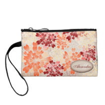 Rojo anaranjado del monograma y flores poner crema bolsos clutch