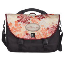 Rojo anaranjado del monograma y flores poner crema bolsa trabajo