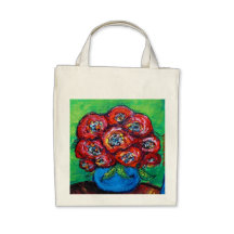 Rosas rojos en florero azul bolsa