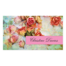 Rosas secos en tarjeta de visita verde del vintage