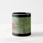 Rubí-gargantas en la taza del alimentador tazas
