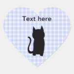 Silueta del gato negro que se sienta. En control a Pegatina