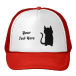 Silueta del gato negro que se sienta gorras