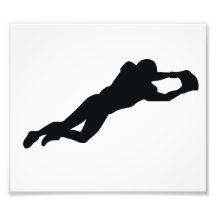 Silueta del negro del futbolista foto