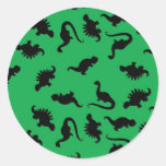 Siluetas del dinosaurio en modelo verde del fondo pegatinas redondas