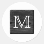 Su monograma de la letra. Imagen de la madera negr Etiquetas Redondas