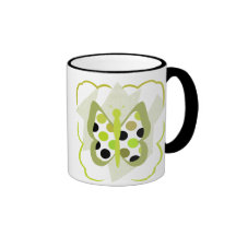 Taza artsy de la mariposa del lunar