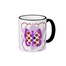 Taza artsy de la mariposa del lunar