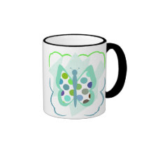 Taza artsy de la mariposa del lunar