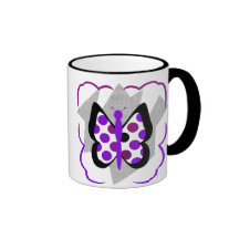 Taza artsy de la mariposa del lunar