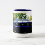 Taza coche-azul del músculo