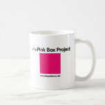 Taza de café rosada de la caja