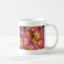 Taza de café rosada de las momias