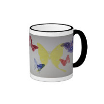 Taza gris del campanero de la mariposa y de la pol