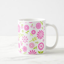 Taza rosada de las flores