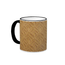Taza texturizada de oro de la tela