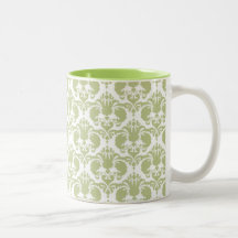 Taza verde femenina del damasco