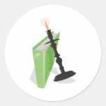 Tenedor de la palmatoria y un Libro verde Etiqueta Redonda