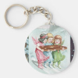 Tres pequeños ángeles con la oblea del navidad llavero personalizado