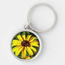 Una flor Negro-Observada amarillo brillante de Sus Llaveros