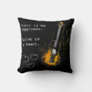 Buscar guitarra negra cojines Música