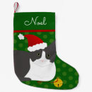 Buscar gato gris calcetines navideños Gatito