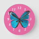 Buscar mariposa azul relojes de pared Rosa