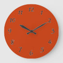 Buscar naranja quemado relojes de pared Rojo