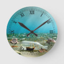 Buscar peces relojes de pared Bajo el agua