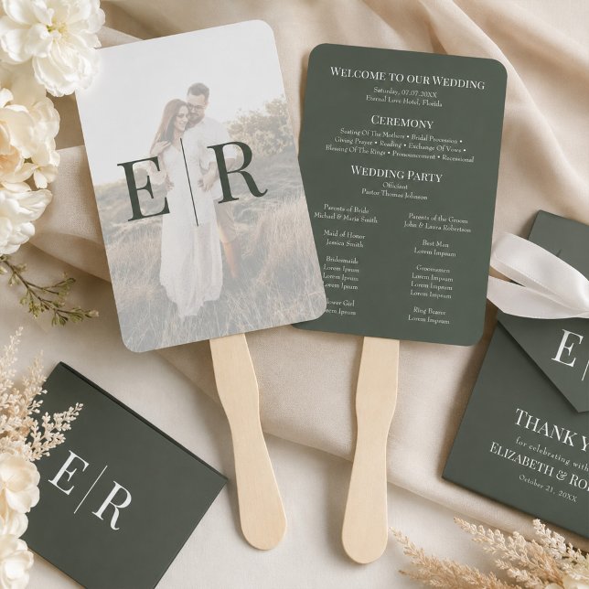 Abanico de mano para programa de boda con monogram (Dark Olive Monogram Wedding Program Hand Fan on a table with wedding decor and flowers)