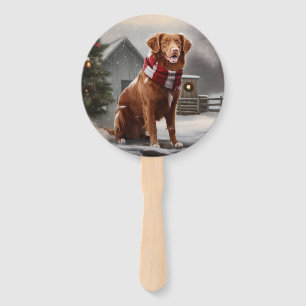 Abanico Perro Nova Scotia Duck Toller en Navidad con nieve