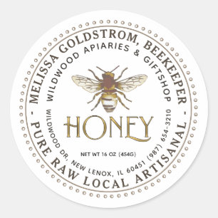 Abeja de la etiqueta de miel sobre oro metálico de