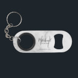 Abrebotellas De Llavero Modern Script Personalized Groomsman<br><div class="desc">Add a personal touch to your wedding with personalized groomsman gift. This design features personalized groomsman's name in grey modern script font style and monogram in light grey modern script font style as background with title and wedding date in grey modern sans serif font style on white marble background. Also...</div>