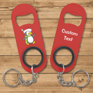 Abrebotellas De Llavero pingüino de Navidad caminando sobre la nieve